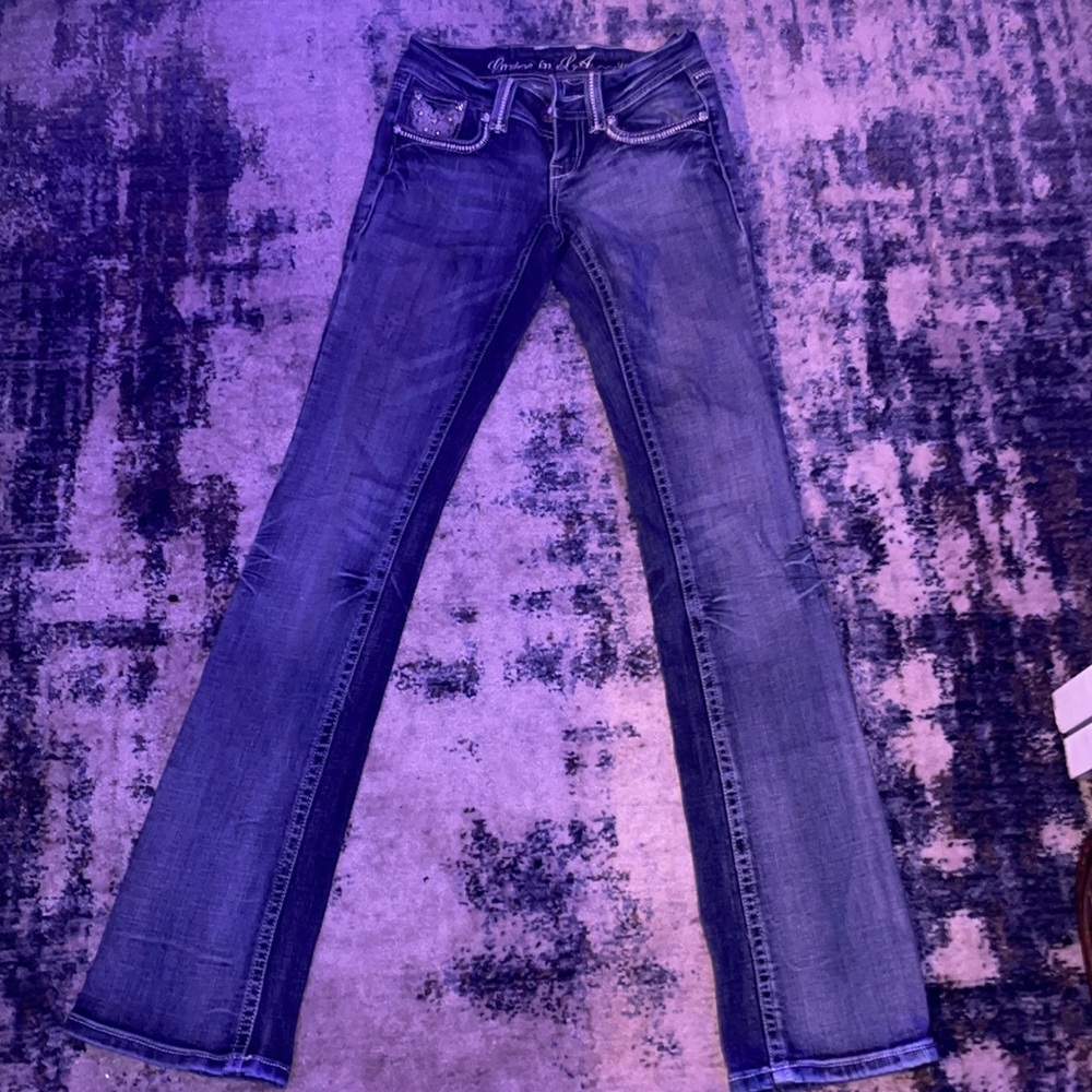 The branding on the back is a little damaged but jeans are in good condition